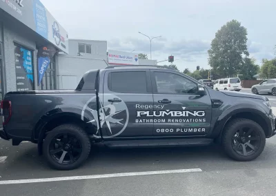 Regency Plumbing commercial van wrapping rear and side signage layout